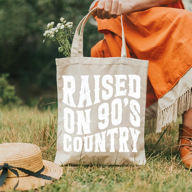 Raised on 90’s country tote bag